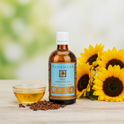 A bottle of TANAMERA Basil Massage Oil with a label and cap visible, on a white background.